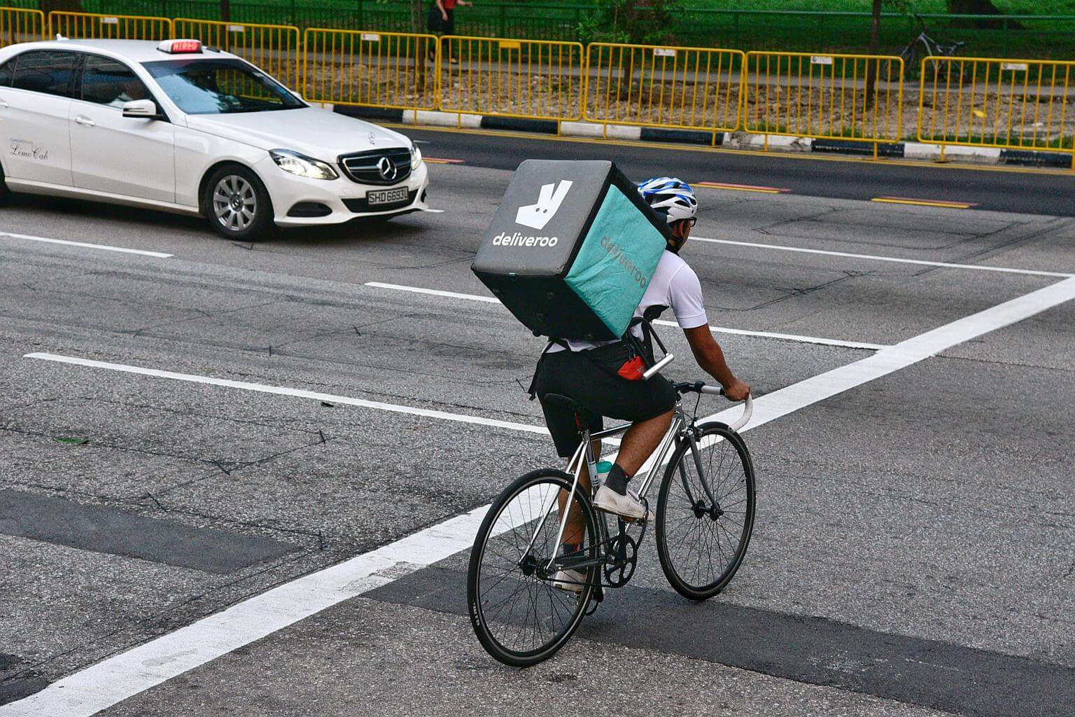 Cyclist delivering parcels